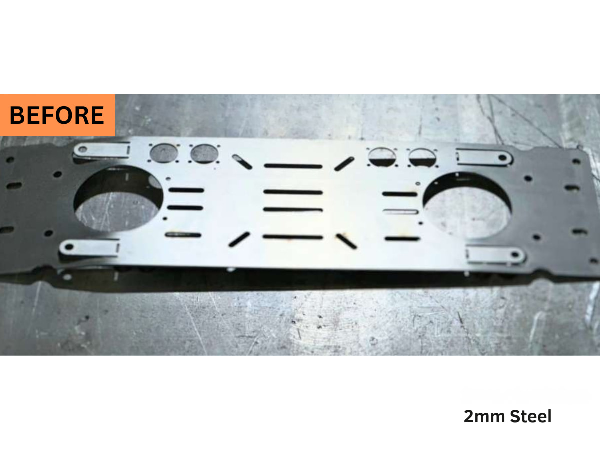 Warped 2 mm laser-cut steel chassis plate before leveling